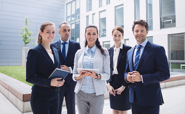 Professional team posing confidently with immigration consultants in kerala